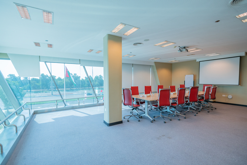 Large warehouse with cement floors and high ceiling windows